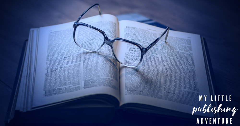 Everything I did wrong when I published my first novel. A pair of glasses rests on an open book.